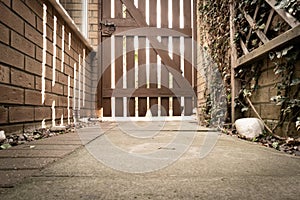 Ground level view of a locked side gate.