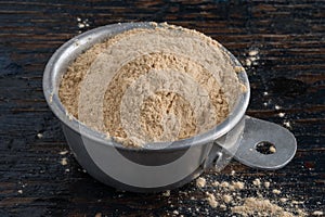 Ground Maca Root in a Measuring Cup