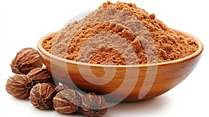 Ground nutmeg powder in bowl, whole nuts, white background, spice