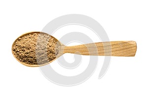 Ground nutmeg powder in wooden spoon isolated on white background. spice for cooking food, top view