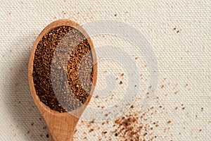 Ground Nutmeg Spilled from a Teaspoon