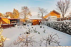 Ground of an outdoor garden covered by abundant accumulation of snow