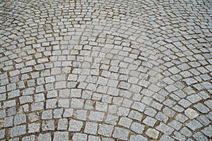 Ground pattern of grey brick granite stone texture outdoor pedestrian pavement surface in rough square cut pattern background