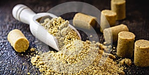 Ground peanut powder, on a rustic table, called Brazilian PaÃ§oca