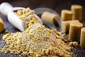 Ground peanut powder, on a rustic table, called Brazilian PaÃ§oca