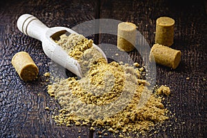 Ground peanut powder, on a rustic table, called Brazilian PaÃ§oca