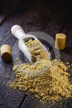 Ground peanut powder, on a rustic table, called Brazilian PaÃ§oca