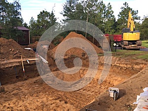 In ground residential swimming pool construction. Excavation.
