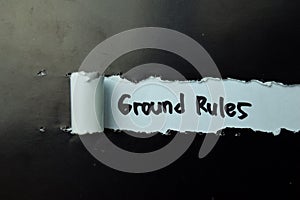 Ground Rules Text written in torn paper