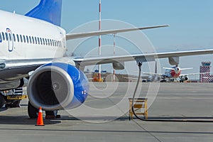 Ground service before flight. Refueling of airplane at airport