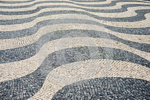 Ground street decoration traditional Lisbon cobblestone wave pattern