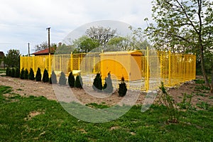 ground with tanks for liquefied gas. Modern gas installation with protective fencing. Yellow fence. Supply of gas to