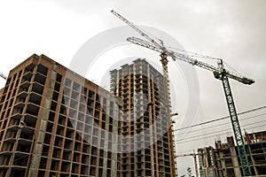 Ground view of a new modern residential house building under construction. Real estate development concept. Multi story home from