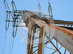 Ground view over electric power tower