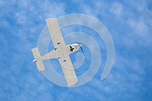 Ground view of a small plane flying in Turkey