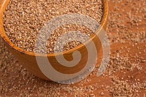 Ground Wheat into a bowl. Trigo para quibe. Kibbeh photo