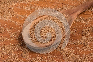Ground Wheat into a spoon. Trigo para quibe. Kibbeh photo