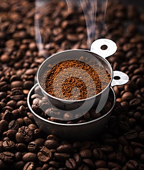 Grounded coffee, beans, coffe maker and spicces