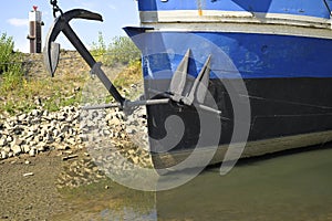 Grounded ship due to low water level of rhine river  in germany.Water shortage, drought, climate change and global warming concept