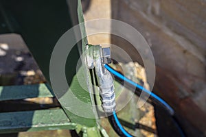 A grounding cable connecting the metal railings on the railway bridge.