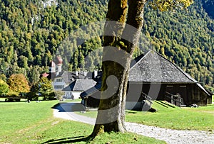 On the grounds of the Hirschau peninsula in Berchtesgaden with green meadows and mountains in the background photo