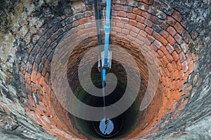 Groundwater well with water in the bottom