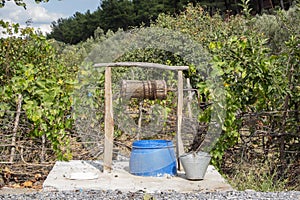 Groundwater wells in the countryside with chains and bucket, Water well in the nature