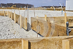 Groundwork Preparation at Construction Site with Rebar and Formwork, Daytime