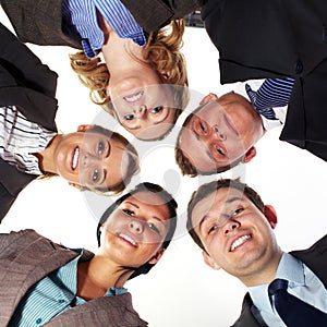 Group of 5 businesspeople in a circle, low angle