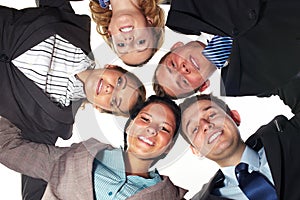 Group of 5 businesspeople in a circle, low angle