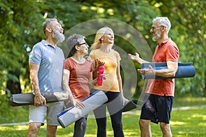 Group Of Active Senior People Having Fun While Training Together Outdoors