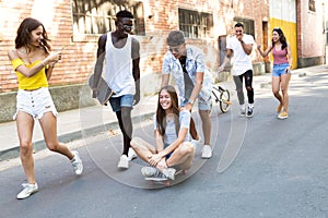 Group of active teenagers making recreational activity in an urban area.