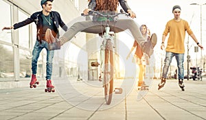 Group of active teenagers in town. four teens making recreational activity in an urban area photo