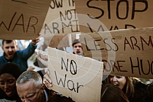 Group of activist people marching for world peace.