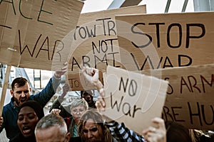 Group of activist people marching for world peace.