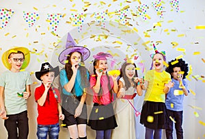 Group of adorable kids having fun at birthday party