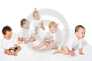 group of adorable multicultural toddlers with cash and credit cards