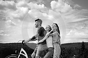 Group adventure with happy and smiling. Woman riding on bike on road along trail on mountain. Camping, jungle adventure