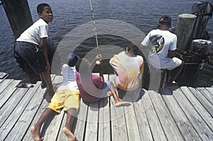 Group of African-American children fishing
