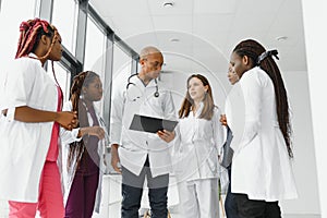 group of african american doctor and nurse in hospital ward.