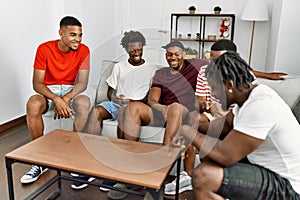 Group of african american people smiling happy sitting on the sofa at home