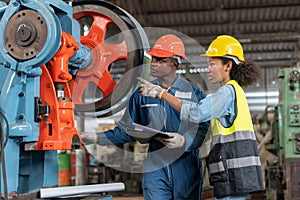 group of African American worker Industrial Engineers man and inspector manager woman checking and repair mechanical with clip