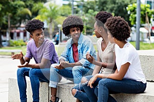 Group of african american young adults in discussion