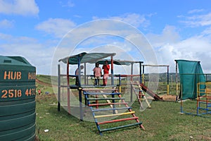 Group of African children playing outdoors in a playground, Swaziland, southern Africa