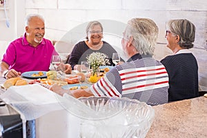 Group of aged people having lunch