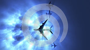 Group airplanes flying under storm sky