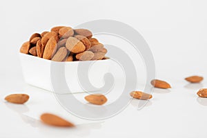 Group of almonds on white background