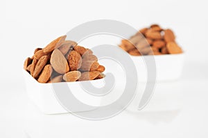 Group of almonds on white background