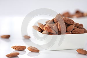 Group of almonds on white background