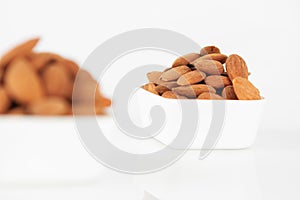 Group of almonds on white background